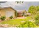 Inviting backyard with lush landscaping, a built in BBQ, and covered patio perfect for entertaining at 2383 Rainswept Ave, Henderson, NV 89052