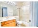 Bathroom featuring a shower and tub combination with a glass door at 2383 Rainswept Ave, Henderson, NV 89052
