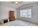 Bedroom with vaulted ceiling, wood-style flooring, and backyard views at 2383 Rainswept Ave, Henderson, NV 89052