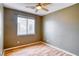 Bedroom with wood floors, ceiling fan, and a window with blinds at 2383 Rainswept Ave, Henderson, NV 89052