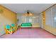 A covered patio with outdoor furniture and a ceiling fan at 2383 Rainswept Ave, Henderson, NV 89052