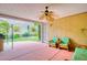 A covered patio with outdoor furniture and an entrance to the backyard at 2383 Rainswept Ave, Henderson, NV 89052