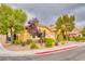 Cozy single-story home with a well-manicured front yard featuring mature trees at 2383 Rainswept Ave, Henderson, NV 89052