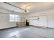 Clean and spacious garage with shelving, water filtration and ample room for vehicles at 2383 Rainswept Ave, Henderson, NV 89052