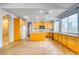 Open kitchen features light wood cabinets, a center island, and modern appliances at 2383 Rainswept Ave, Henderson, NV 89052