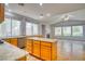 Spacious living room features tile flooring, a ceiling fan, and multiple windows at 2383 Rainswept Ave, Henderson, NV 89052
