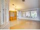 Bright living room boasting tile flooring, large windows, and chandelier at 2383 Rainswept Ave, Henderson, NV 89052