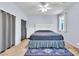 Comfortable bedroom with soft blue walls, plush carpeting, and coordinated decor at 2409 Cockatiel Dr, North Las Vegas, NV 89084