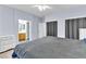 Relaxing main bedroom with soft blue walls, neutral carpet, and generous closet space, creating a comfortable retreat at 2409 Cockatiel Dr, North Las Vegas, NV 89084