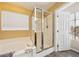 Bright bathroom featuring a tub and shower combination with tile surround and natural light at 248 Hyssop Ct, Henderson, NV 89015