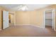 Well-lit carpeted bedroom with an open doorway and a closet, offering ample space at 248 Hyssop Ct, Henderson, NV 89015