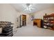 Bedroom with ceiling fan and view to a front yard window at 248 Hyssop Ct, Henderson, NV 89015