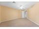 Spacious carpeted bedroom featuring a ceiling fan and neutral wall color at 248 Hyssop Ct, Henderson, NV 89015