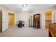 Neutral bedroom with ceiling fan and a walk-in closet and view to a hallway at 248 Hyssop Ct, Henderson, NV 89015