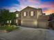 Charming two-story home featuring a well-manicured lawn, mature trees, and a three-car garage at 248 Hyssop Ct, Henderson, NV 89015