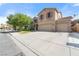 Inviting two-story home with a spacious three-car garage, well-maintained landscaping, and a long driveway at 248 Hyssop Ct, Henderson, NV 89015
