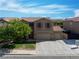 Inviting two-story home with three-car garage and a well-maintained lawn at 248 Hyssop Ct, Henderson, NV 89015