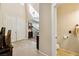Foyer featuring tile floors, high ceilings, and a view into the living room at 248 Hyssop Ct, Henderson, NV 89015
