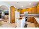 Charming kitchen with oak cabinets, a center island, and stainless steel appliances at 248 Hyssop Ct, Henderson, NV 89015