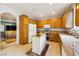 Well-equipped kitchen featuring wooden cabinets, a center island, and modern appliances at 248 Hyssop Ct, Henderson, NV 89015
