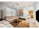 Bright living room featuring neutral tones, plush seating, and stylish decor and easy access to the kitchen at 248 Hyssop Ct, Henderson, NV 89015