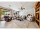 Bright living room with large windows, tile floors, and access to the backyard at 248 Hyssop Ct, Henderson, NV 89015