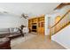 Comfortable living room with tile flooring, built-in entertainment center, and a cozy seating area at 248 Hyssop Ct, Henderson, NV 89015