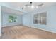 Bright living room with neutral paint, carpet, and large windows offering neighborhood views at 248 Hyssop Ct, Henderson, NV 89015
