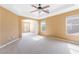 Large main bedroom with carpet, ceiling fan, and an en-suite bathroom; abundant natural light at 248 Hyssop Ct, Henderson, NV 89015