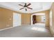 Spacious main bedroom with carpet, ceiling fan, recessed lighting, and en-suite bathroom and walk-in closet at 248 Hyssop Ct, Henderson, NV 89015
