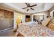 Spacious main bedroom showcasing an ensuite bathroom, a tray ceiling, and ample natural light at 248 Hyssop Ct, Henderson, NV 89015