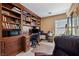 Stylish office featuring custom built-in bookshelves and a comfortable workspace, perfect for productivity at 248 Hyssop Ct, Henderson, NV 89015