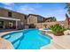 Inviting backyard pool and spa with lush landscaping and covered patio area, perfect for outdoor entertaining at 248 Hyssop Ct, Henderson, NV 89015