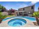 Beautiful backyard oasis featuring a custom pool and spa with mature landscaping and spacious patio at 248 Hyssop Ct, Henderson, NV 89015