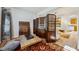Sitting room with artistic decor, folding screen, and vibrant rug adjacent to the living room at 248 Hyssop Ct, Henderson, NV 89015