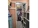 Well-organized walk-in closet with shelves, hanging rods, and a tidy storage system at 2484 Domingo St, Las Vegas, NV 89121