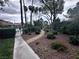Serene community landscape with a paved walkway leading to a refreshing swimming pool at 2484 Domingo St, Las Vegas, NV 89121
