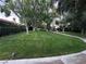 Lush community green space featuring manicured lawns and a winding pathway, great for walking at 2484 Domingo St, Las Vegas, NV 89121