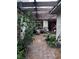 Charming courtyard patio area with tile floors, a hammock, and comfortable seating at 2484 Domingo St, Las Vegas, NV 89121