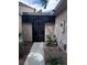 View of gated entry featuring mature landscaping at 2484 Domingo St, Las Vegas, NV 89121