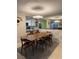 Modern dining area with a large table, seating for six, and stylish lighting at 2484 Domingo St, Las Vegas, NV 89121