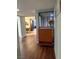 Hallway with wood-look flooring and an orange cabinet that leads to the dining room at 2484 Domingo St, Las Vegas, NV 89121