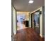 Inviting entryway with wood floors flowing into a bright living space, offering seamless transition and modern appeal at 2484 Domingo St, Las Vegas, NV 89121