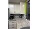 The kitchen boasts white cabinets, granite countertops, and stainless steel appliances at 2484 Domingo St, Las Vegas, NV 89121