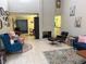View of the living room showing fireplace, seating, and open layout connecting to the dining area at 2484 Domingo St, Las Vegas, NV 89121