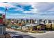 Community aerial view showcases pools, playgrounds, and colorful housing with mountain views at 2518 Veronella St, Henderson, NV 89044