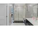 Bathroom featuring glass shower with a built-in bench, modern fixtures, and neutral tile at 2518 Veronella St, Henderson, NV 89044