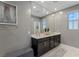 Bathroom featuring double vanity, modern fixtures, and an oversized mirror for a spacious feel at 2518 Veronella St, Henderson, NV 89044