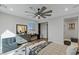 Bright bedroom featuring a ceiling fan, modern furniture, neutral decor, and ample natural light at 2518 Veronella St, Henderson, NV 89044