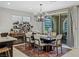 Chic dining room with stylish decor, modern chandelier, and plenty of natural light at 2518 Veronella St, Henderson, NV 89044